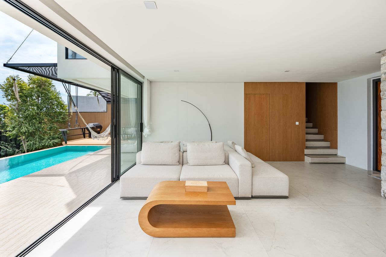 Living room with sliding doors to the pool