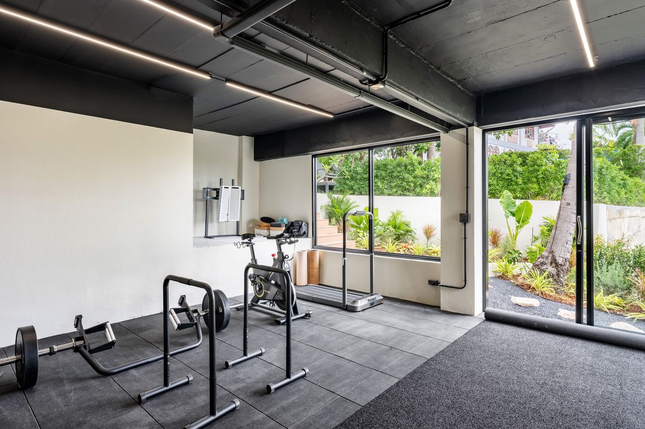 Cardio corner of the gym, opening onto the garden